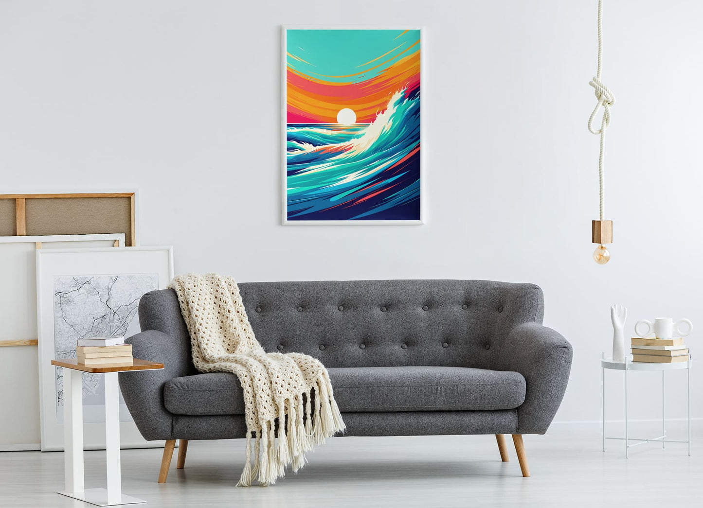 Costa Vicentina printed poster in a white frame, hanging above a grey sofa. A stunning ocean wave artwork for modern living spaces.