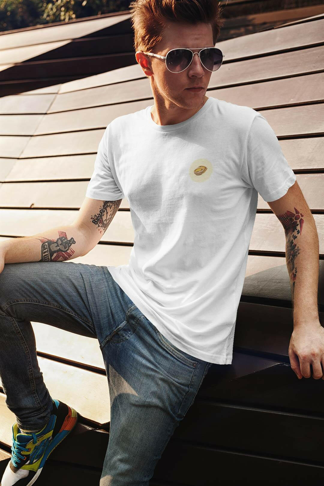 White Pastel de Nata T-Shirt worn by a stylish man with sunglasses. Organic cotton, minimalist Lisbon fashion.