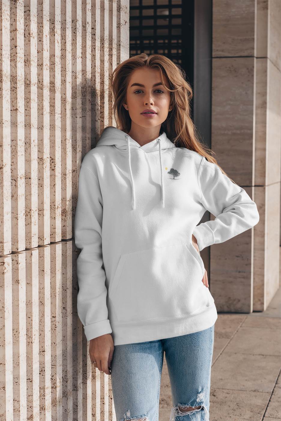 White Evora Sunset Minimal Organic Hoodie styled with jeans, embodying minimalist and ethical fashion. Perfect for casual and eco-conscious wear.
