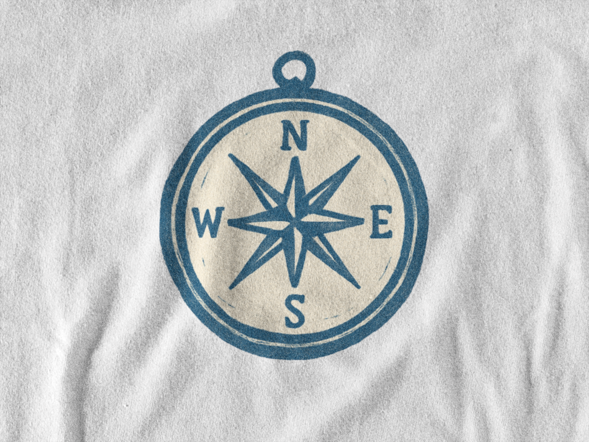Heritage design shirt with compass symbol.