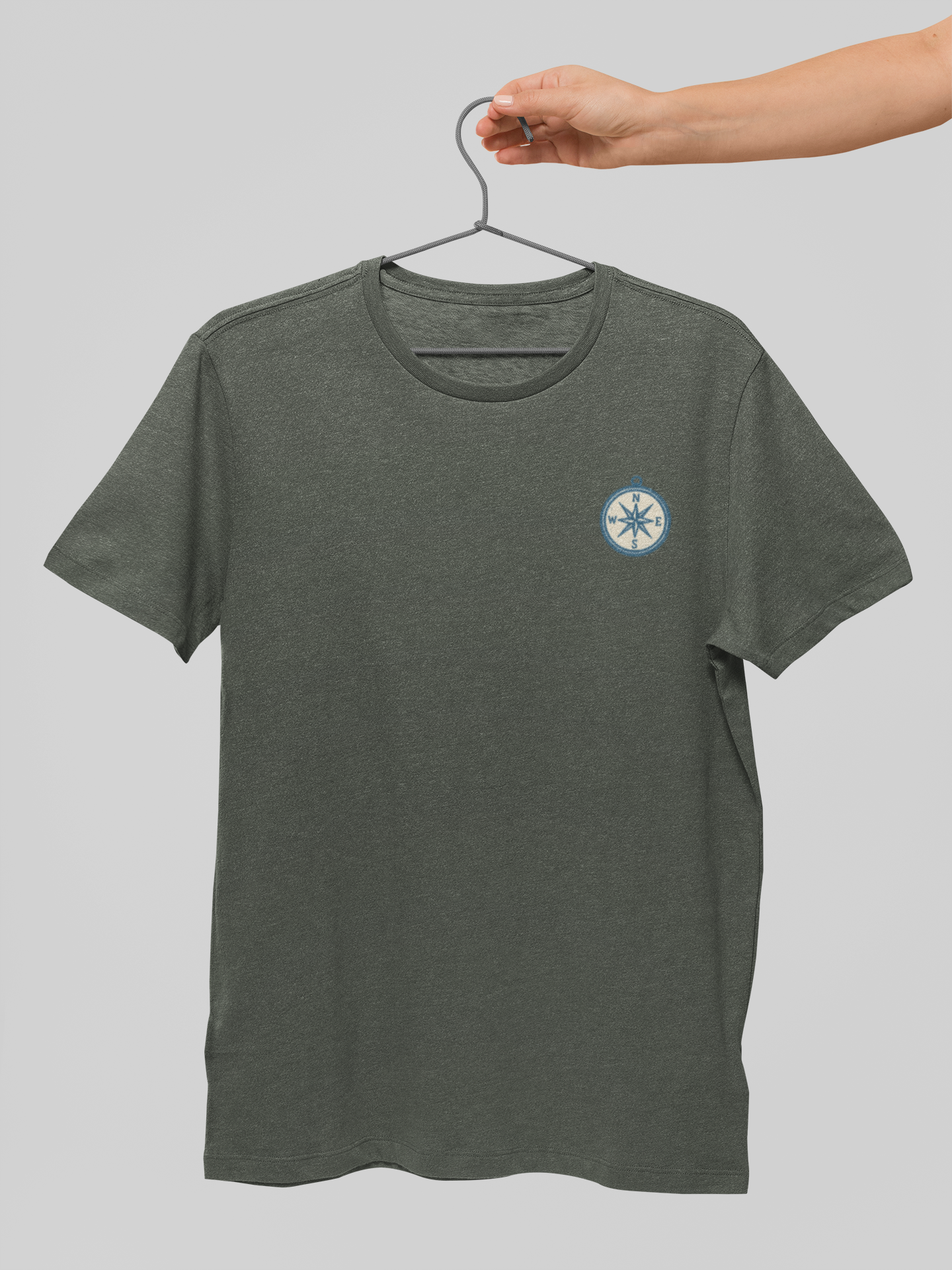 Minimal compass shirt for travel and adventure style.