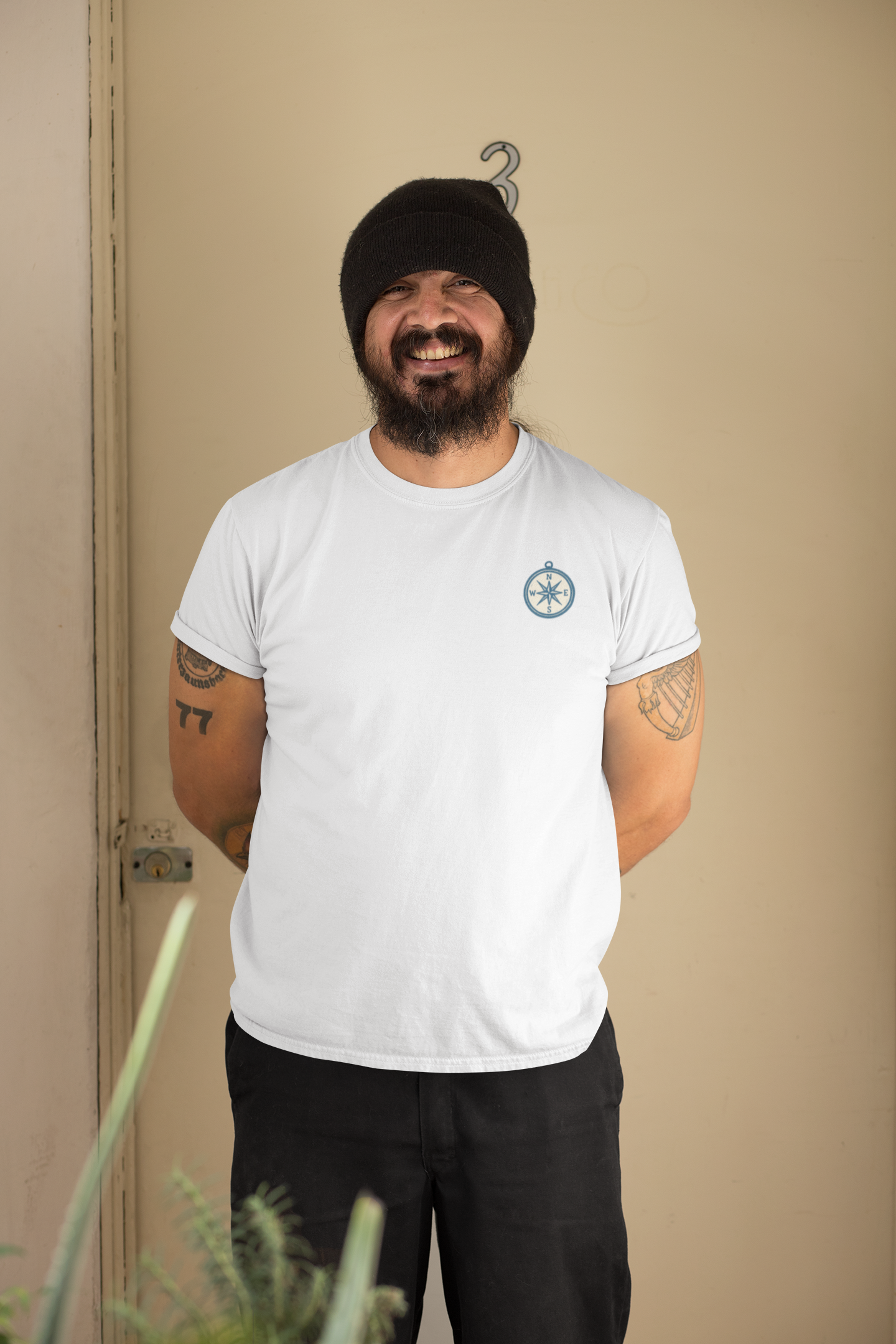 Line-art compass design printed on chest.