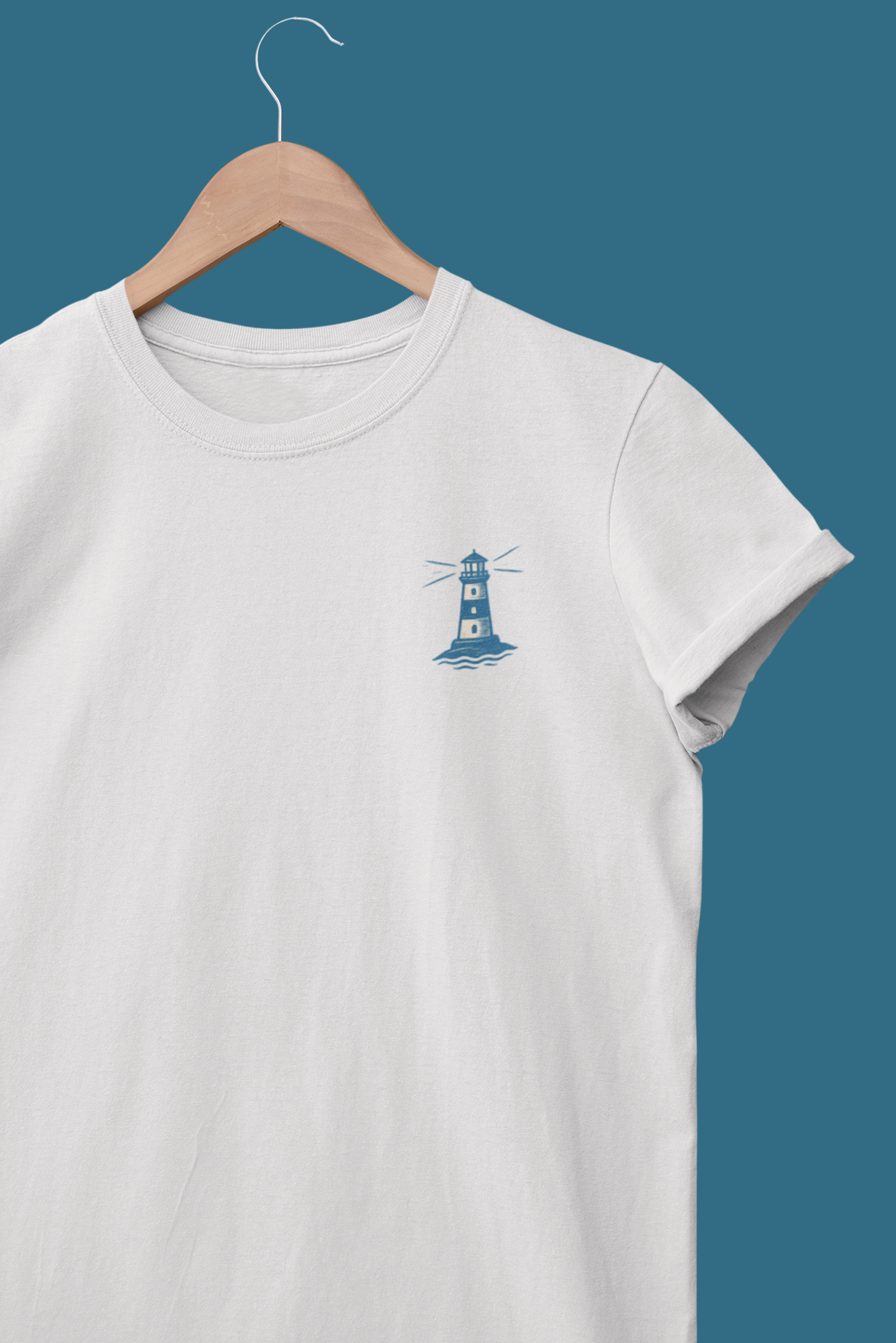 Line-art lighthouse design printed on white t-shirt.