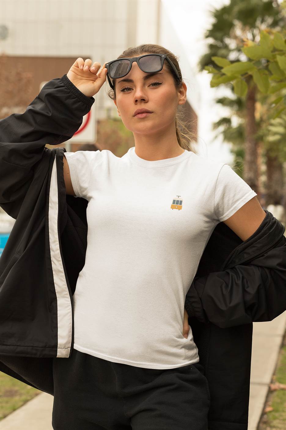 Classic white Lisbon Electrico Tram T-Shirt with a small tram print. Made from organic cotton for a breathable and ethical wardrobe choice.
