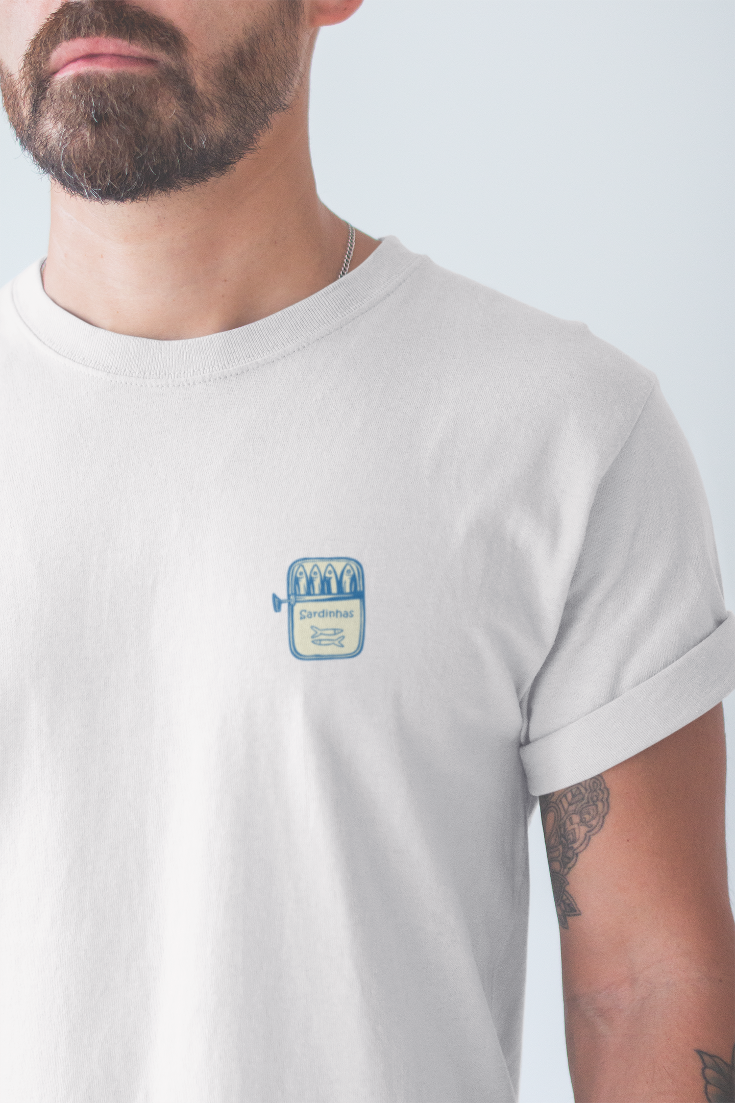 Unisex organic cotton t-shirt with minimal canned sardine logo.