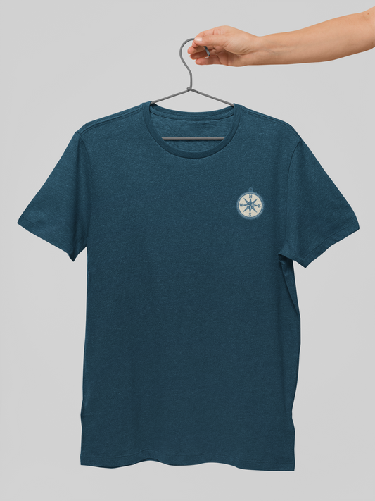 Blue t-shirt with a logo on a hanger against a gray background