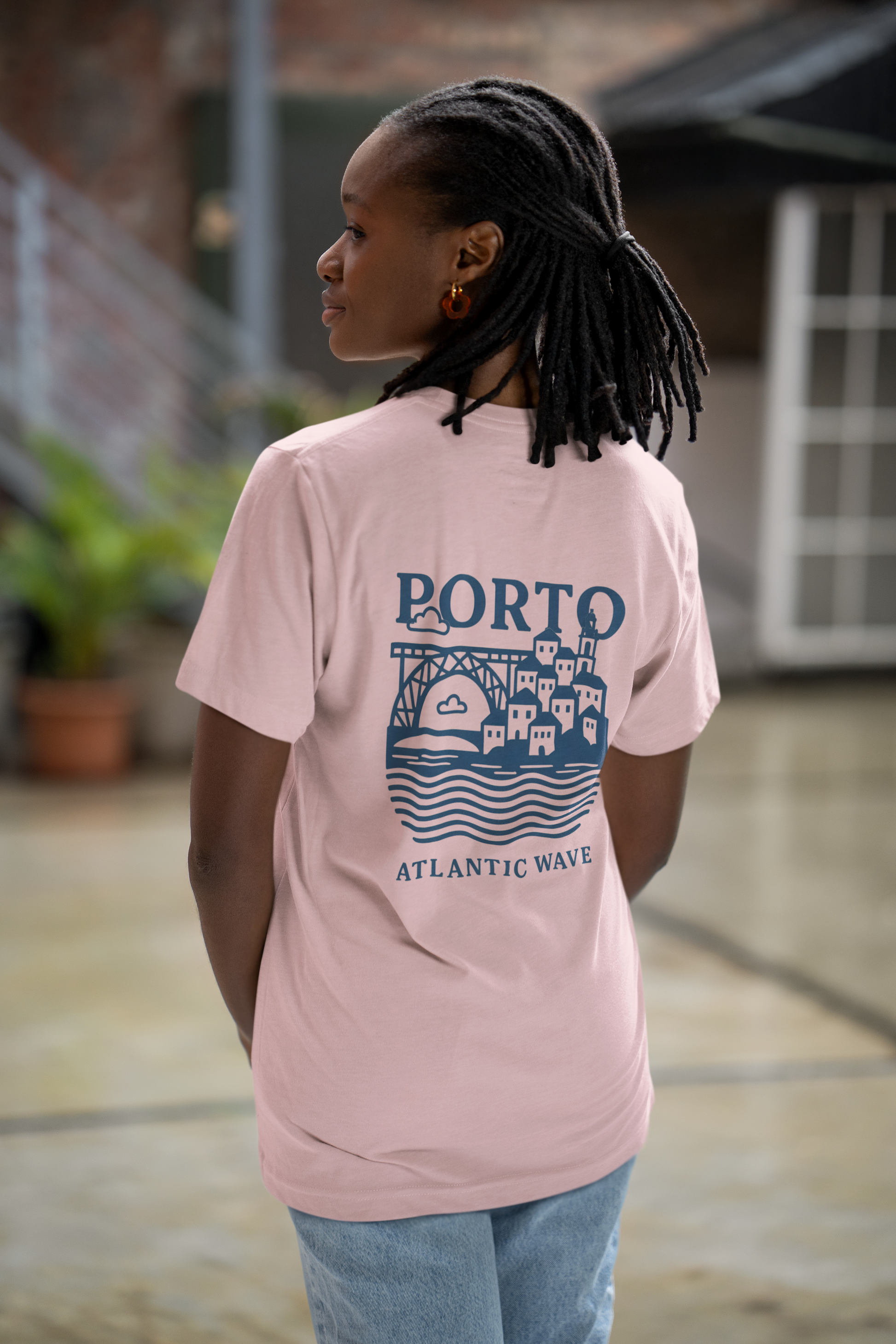 Unisex t-shirt with large blue PORTO logo printed on the back.