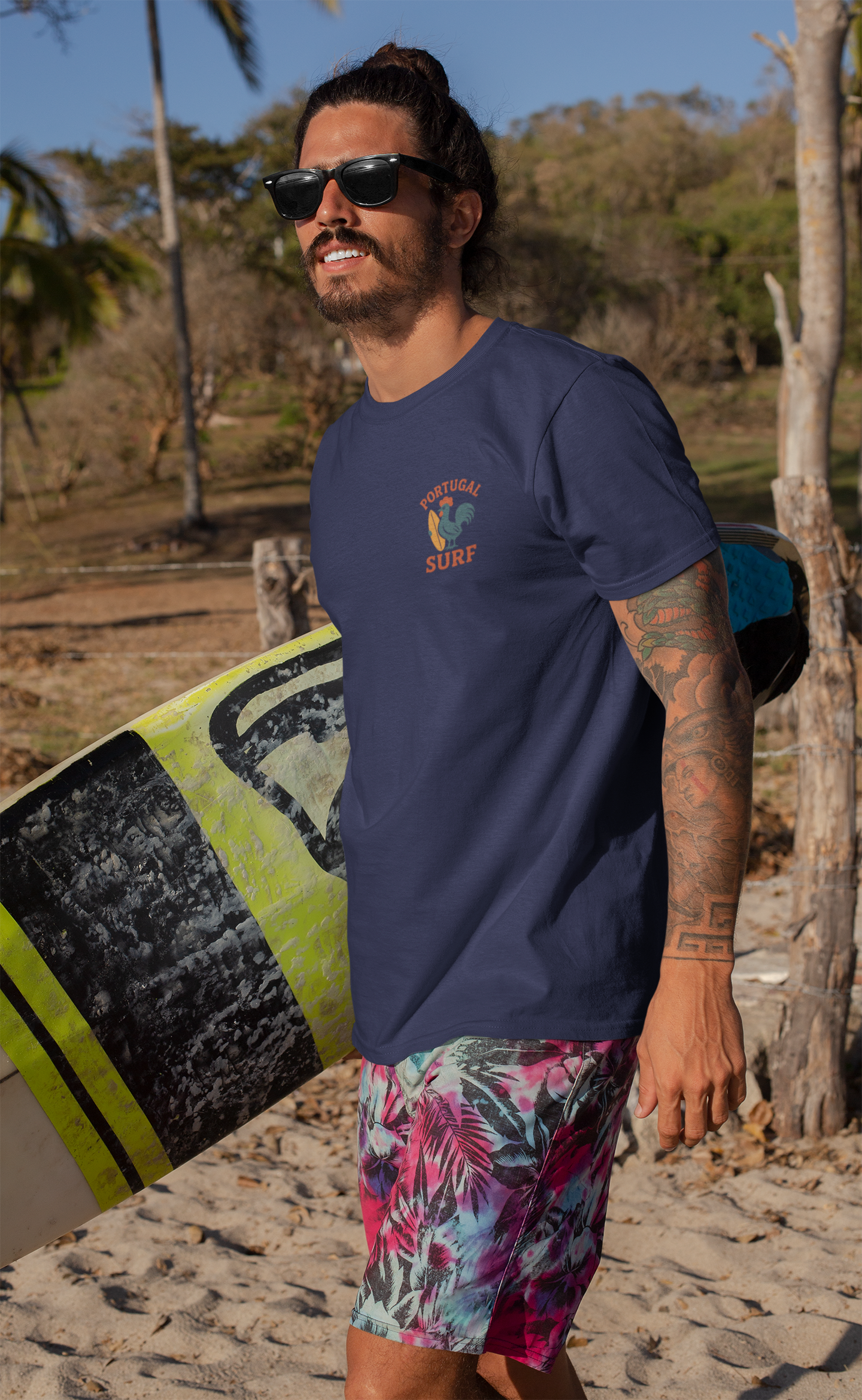 Model wearing the Surf Rooster Organic Cotton Tee, beach-ready.