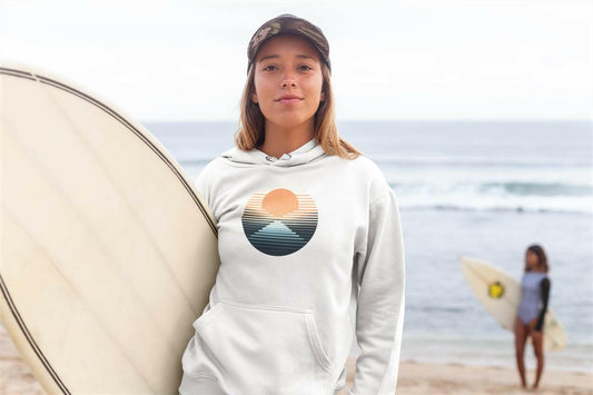 Unisex organic Nazaré vintage hoodie in light color, featuring a retro surf sunset design. Perfect eco-friendly apparel for beach lovers and surfers.
